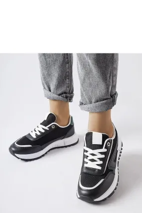 Black sneakers with a green accent